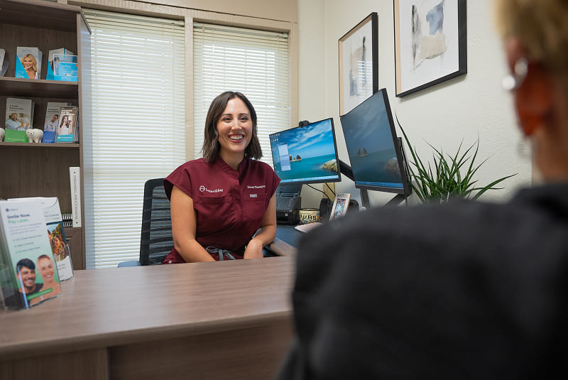 Dental office team member working at desk