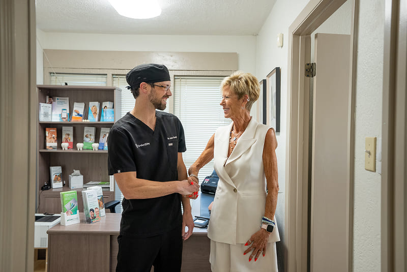 Dental team member walking through office hallway
