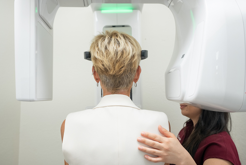 Patient undergoing digital dental imaging procedure - mid shot