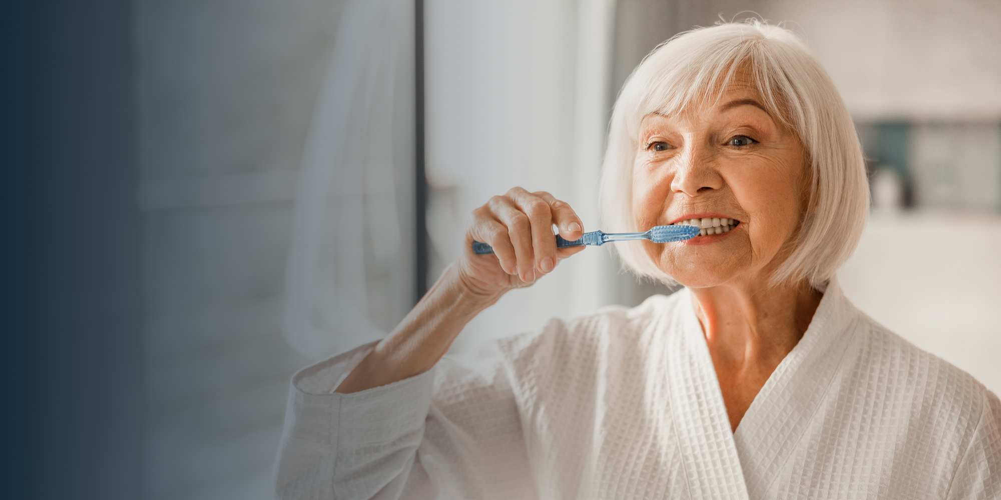 older woman brushing teeth